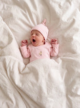 Load image into Gallery viewer, Yawning newborn wearing pink chick embroidered organic cotton bodysuit and matching knot hat