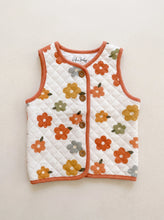 Load image into Gallery viewer, Cream quilted organic cotton baby and toddler gilet with retro floral print, terracotta trim and button fastening