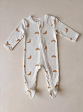Load image into Gallery viewer, Cream organic cotton baby sleepsuit with croissant print and zip fastening