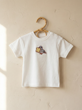 Load image into Gallery viewer, White organic cotton t-shirt featuring an embroidered pigeon design