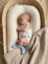 Load image into Gallery viewer, Baby wrapped in organic cotton muslin baby blanket in soft neutral tones
