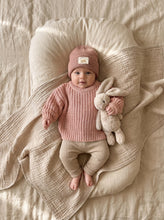 Load image into Gallery viewer, Baby wearing an oversized chunky knit jumper in dusty rose made from 100% cotton, styled with matching knit leggings and a knit beanie.