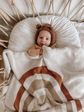 Load image into Gallery viewer, baby wrapped in rainbow-patterned knit blanket – cosy and soft