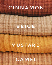 Load image into Gallery viewer, rolled organic baby blankets showing textured weave in cinnamon and mustard