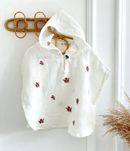 Load image into Gallery viewer, soft cream poncho with hood and floral prints styled on hanger – baby clothing