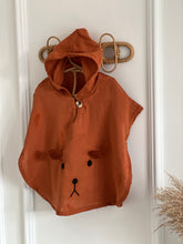 Load image into Gallery viewer, organic cotton baby poncho with bear embroidery styled on hanger – hooded design