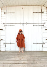 Load image into Gallery viewer, toddler wearing baby poncho with hood – relaxed fit and summer-ready design