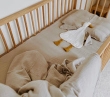 Load image into Gallery viewer, organic goose-shaped comforter styled in a newborn crib setting
