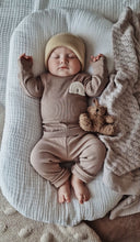 Load image into Gallery viewer, baby sleeping in beige ribbed rainbow outfit – soft organic cotton set