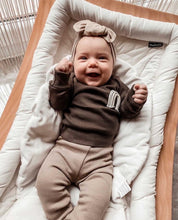 Load image into Gallery viewer, baby girl smiling in brown ribbed outfit – comfortable toddler wear