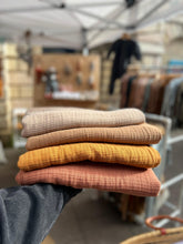 Load image into Gallery viewer, Stack of organic cotton muslin baby blankets in earthy neutral colours