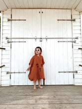 Load image into Gallery viewer, toddler in rust-toned outfit wearing retro baby sunglasses outdoors