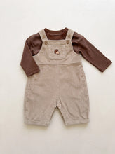 Load image into Gallery viewer,     Beige corduroy acorn dungaree set with brown long sleeve top, wooden button straps and popper fastening at the legs.
