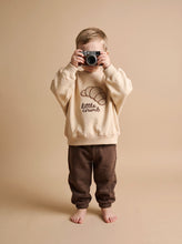 Load image into Gallery viewer, Toddler wearing cream organic cotton croissant sweatshirt with Little Crumb embroidery
