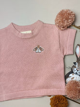 Load image into Gallery viewer, flat lay of moth-embroidered t-shirt on soft background – breathable knit fabric
