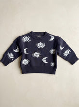 Load image into Gallery viewer, Celestial Knit Jumper in 100% cotton featuring a knitted sun and moon design on a warm ivory textured background.
