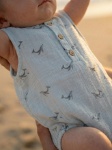 Load image into Gallery viewer, Close-up of organic cotton baby romper with beach background
