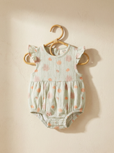 Load image into Gallery viewer, Organic cotton muslin romper with sea shell print hanging on wooden hanger
