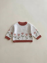 Load image into Gallery viewer, Oversized organic cotton Tulip Knit Jumper for babies and toddlers in ivory with soft pink tulip knit design, photographed in a premium flat lay.
